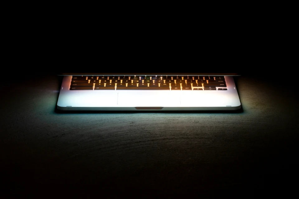 Glowing laptop spotlight dark – luxury digital artwork for the Twilight Digital Pass 12 Months IPTV subscription